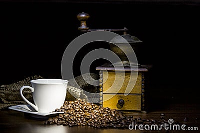 Coffee grinder with cup and coffee beans. Stock Photo