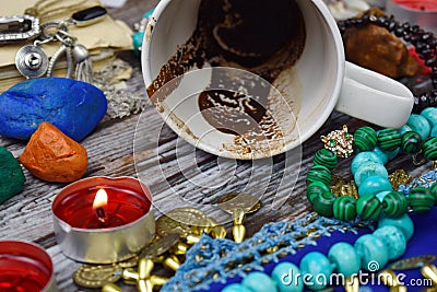 Coffee grounds in the Cup divination. Prediction of fate. Mysticism and mystery. Fortune teller is a fraud. Stock Photo