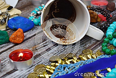 Coffee grounds in the Cup divination. Prediction of fate. Mysticism and mystery. Fortune teller is a fraud. Stock Photo