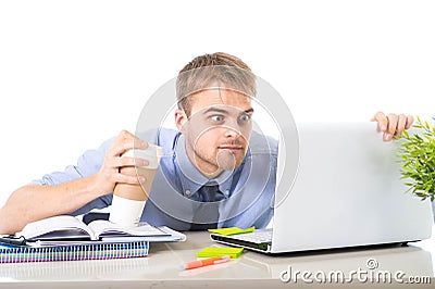 Coffee junkie businessman holding take away cup looking with crazy eyes and funny face expression overworked Stock Photo