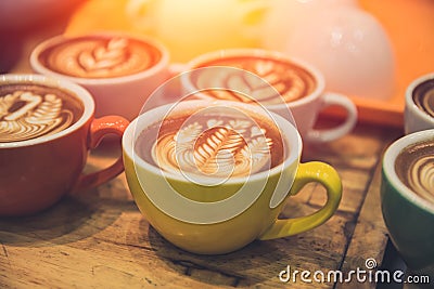 Coffee latte art popular hot drink served on wood table Stock Photo