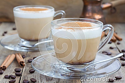 Coffee latte with cinnamon in glass cups Stock Photo