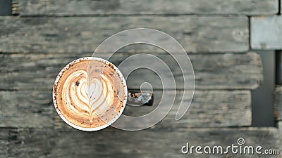 Coffee latte heart texture on wooden floor Stock Photo