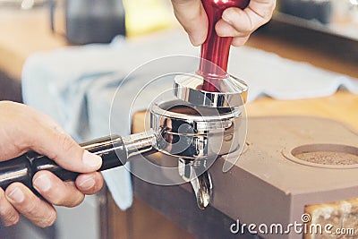 Coffee machine make a black coffee close up hand crushing coffee powder Stock Photo