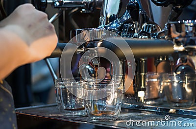 Coffee machine making espresso shot in a cafe shop Stock Photo