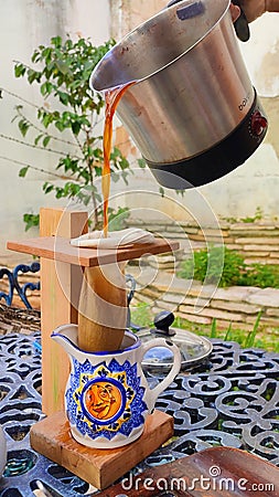 Coffee made in a teapot, traditional style Editorial Stock Photo