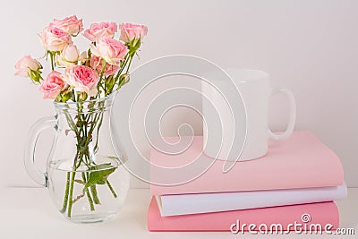 Coffee mug mockup with pink roses Stock Photo