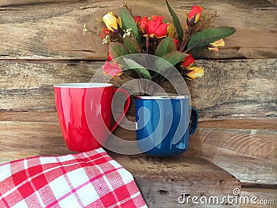 Coffee, napkin and flower on wood background Stock Photo