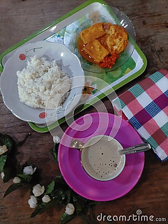 Coffee, napkin, rice and fried tofu Stock Photo