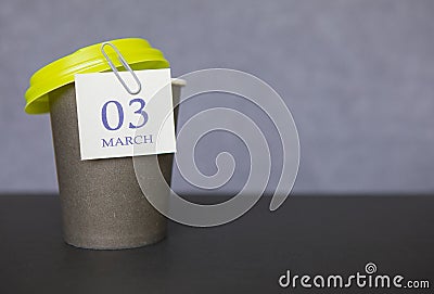 Coffee paper cup with calendar dates for March 03, Spring season. Time for relaxing breaks and vacations Stock Photo