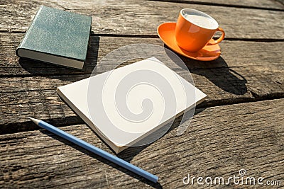 Coffee, pencil, notebook and blank piece of paper Stock Photo