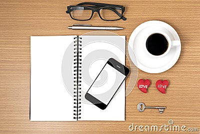 Coffee and phone with key,eyeglasses,notepad,heart Stock Photo