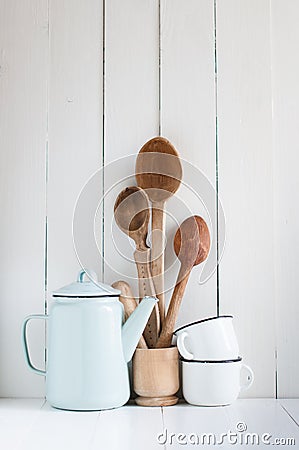 Coffee pot, enamel mugs and rustic spoons Stock Photo