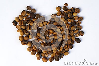 Coffee seeds heart shape on white background Stock Photo