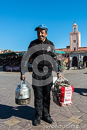 Coffee seller on market square Jamaa El Fna,Morocco. Editorial Stock Photo