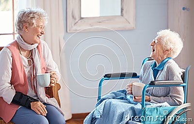 Coffee, senior women and friends laugh for funny story with trust, love and care. Elderly women, wheelchair and disabled Stock Photo