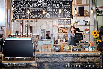 Coffee shop is open - woman at workplace at new open caf Stock Photo