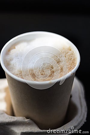 coffee take-away in a paper cup in the car. Stock Photo