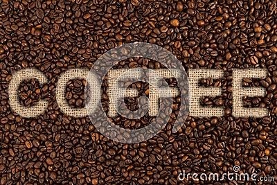 Coffee text on roasted beans and jute bag or sack Stock Photo