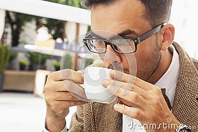 Coffee time. Sucessful businessman enjoying in a cup of coffee Stock Photo