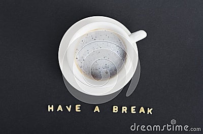 Coffee in a white cup with tiles writing have a break Stock Photo