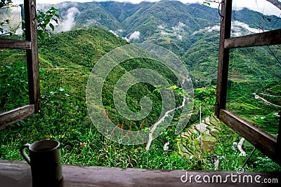 Coffee on window sill with a view of the rice terrace Stock Photo