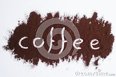 Coffee word written on ground coffee layer, white background Stock Photo