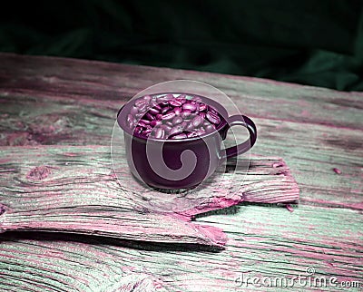 Coffeebeans in ceramic coffee cup Stock Photo