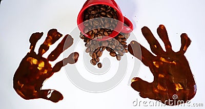 Coffeebeans and a red espresso cup on a table Stock Photo
