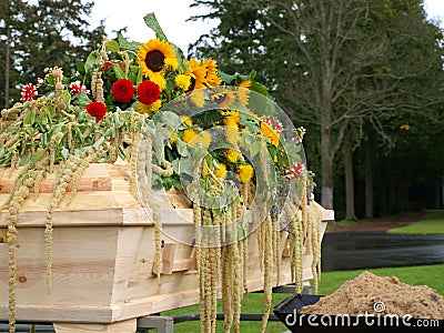 Coffin with flowers Stock Photo