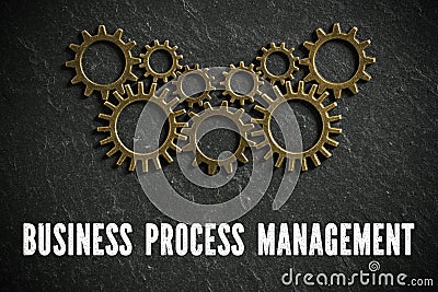 Cogwheels symbolizing complex machinery and the word `business process management ` Stock Photo