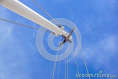 Coil for the iron cable in the tower crane against the blue sky. Mechanical component for crane operation Stock Photo