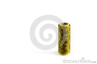 A coil of olive thread. Spool of colored threads on a white background. Waxed sewing thread for leather crafts. Stock Photo