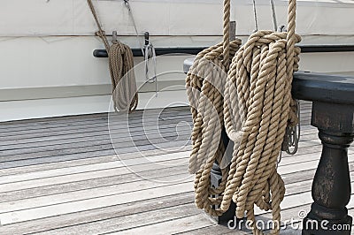 Coiled ropes on sailing ship Stock Photo