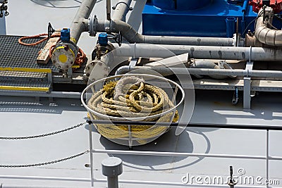 Coiled yellow ship hawsers on the deck of an inland tanker Editorial Stock Photo