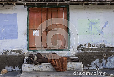 Coimbatore, tamil nadu, India-06-16-2019. Sadhu Baba sleeping on the street near the Perur Shiva temple. Editorial Stock Photo