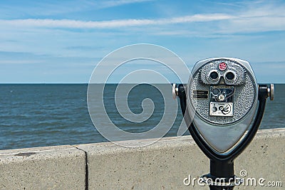 Coin binoculars close-up on the shore of the Atlantic Ocean Editorial Stock Photo