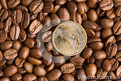 Coin on coffee beans background Stock Photo