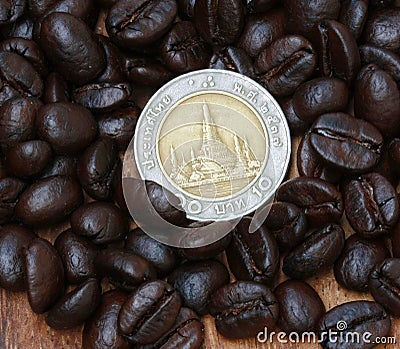 Coin and coffee beans Stock Photo