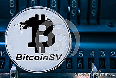 Coin cryptocurrency Bitcoin SV and numbers of the arithmometer. BSV Stock Photo