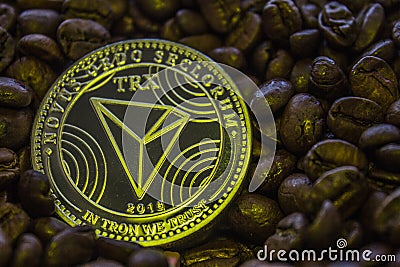 Coin cryptocurrency Tron is on the coffee beans. Editorial Stock Photo