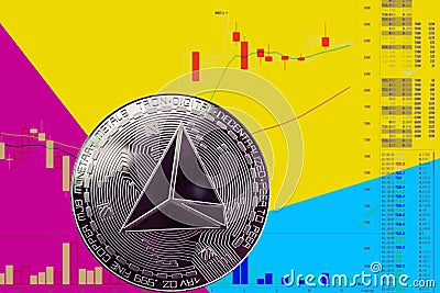 Coin cryptocurrency trx on chart and yellow blue neon background. Stock Photo