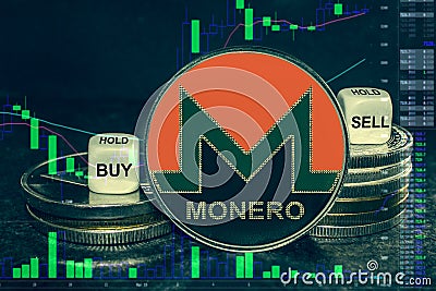 Coin cryptocurrency xmr monero stack of coins and dice. Exchange chart to buy, sell, hold. Editorial Stock Photo