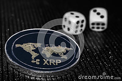 Coin cryptocurrency XRP and rolling dice. Editorial Stock Photo