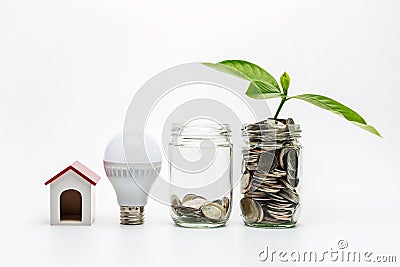 Coin in a glass with energy saving Stock Photo