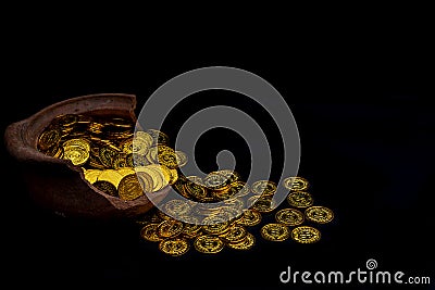 Coin gold in lady hand on lots stacking golden coins in broken jar white background Stock Photo