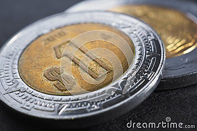 Coin of 1 one Mexican peso close-up. Peso of Mexico. News about economy or currency. Loan and credit. Money and taxes. Focus on Stock Photo