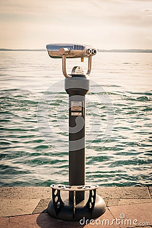 Coin Operated Binocular viewer next to the waterside promenade i Stock Photo