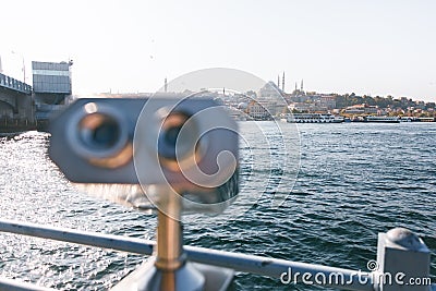 Coin Operated Binocular viewer next to the waterside promenade in Istanbul, Turkey looking out to Bosphorus Strait and city. Stock Photo