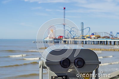 Binoculars overlooking beach in Galveston Stock Photo